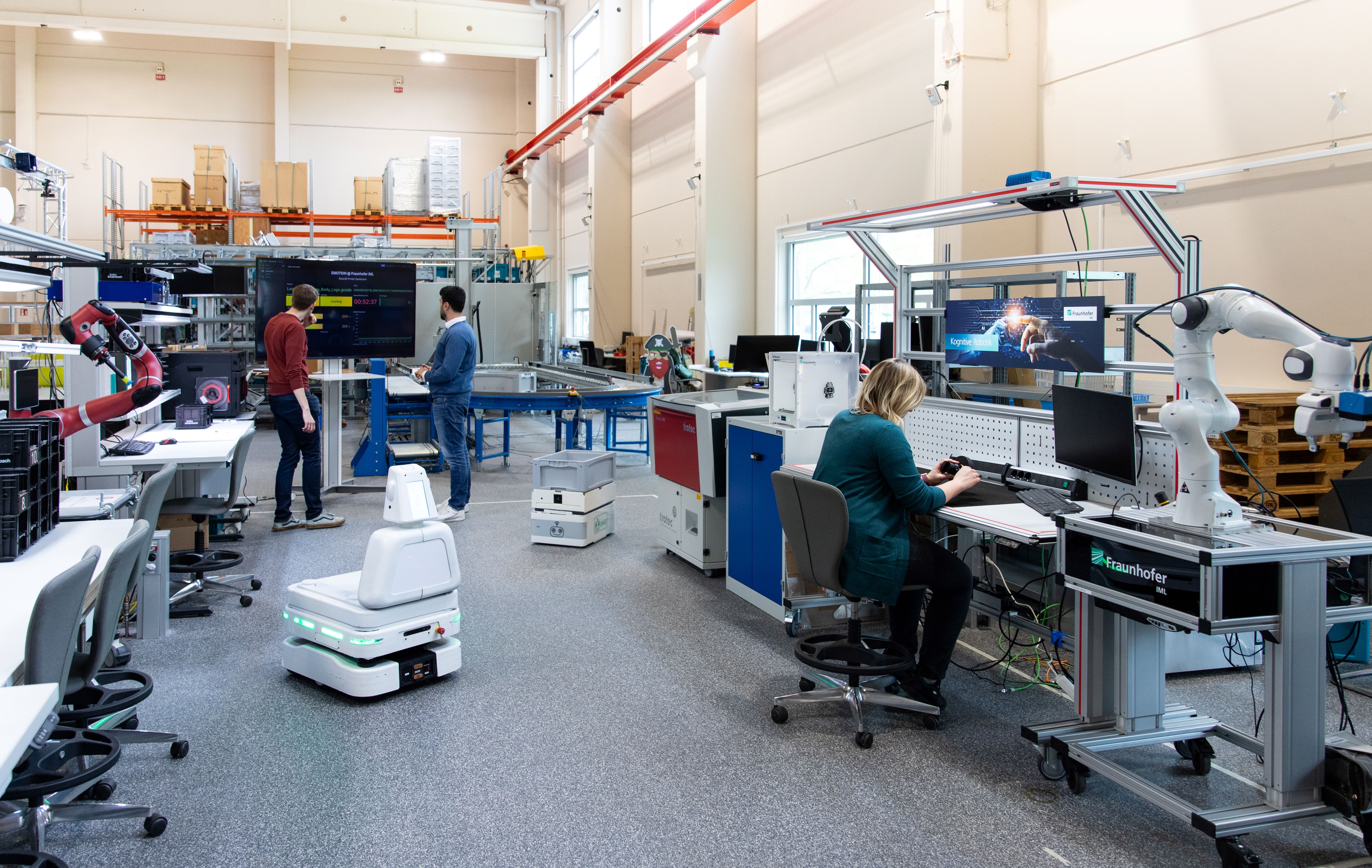 Multiple people working together in a laboratory